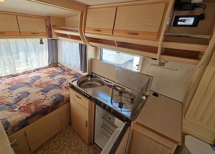 Kitchen with stove and sink